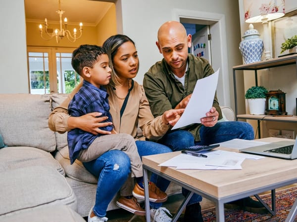 A financial counselor meeting with a family